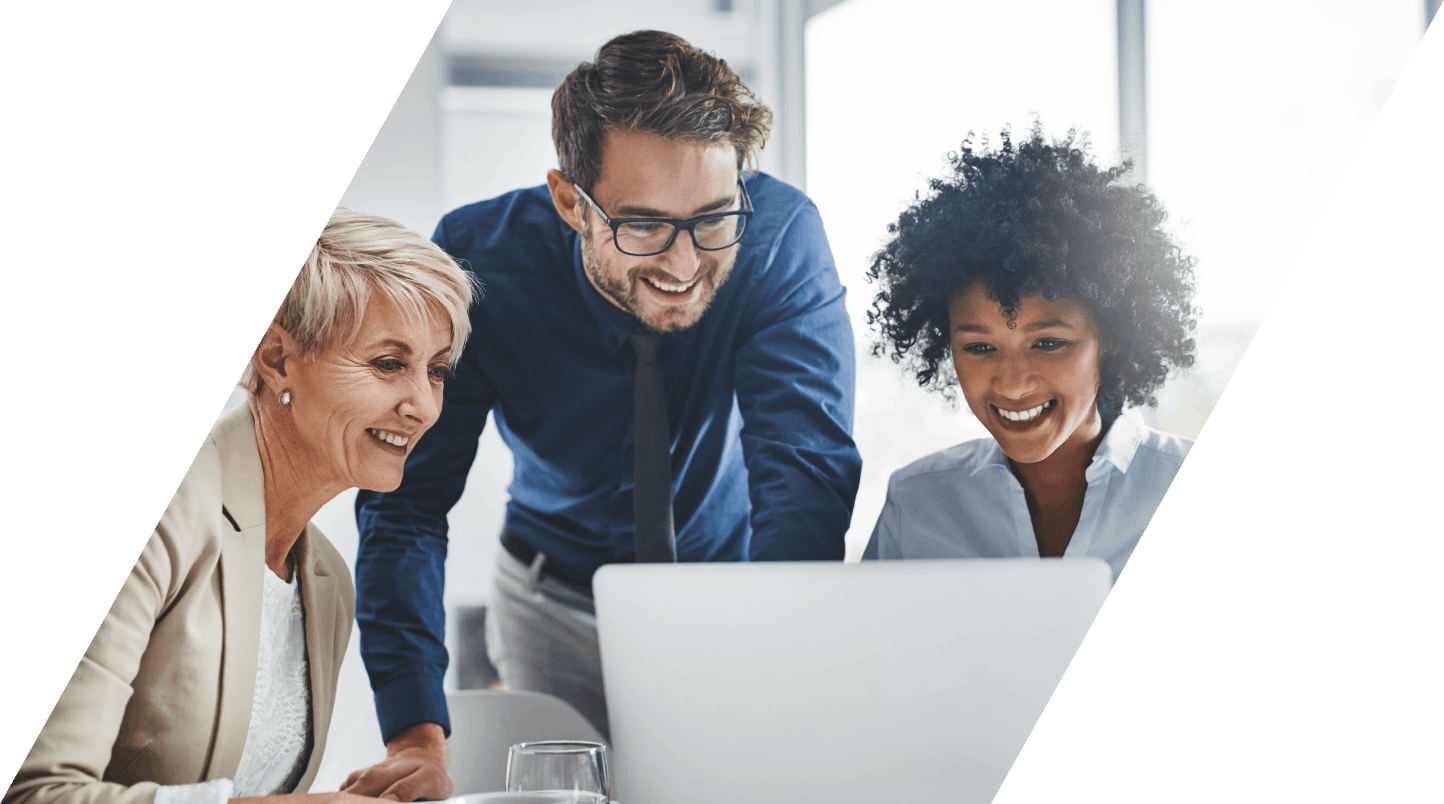 3 people in suits looking at laptop