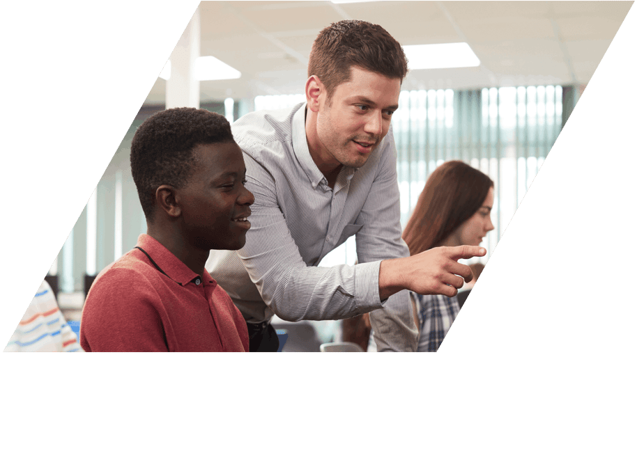 Male teacher pointing at screen showing male student