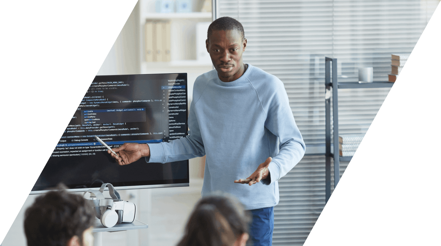 Man with pen pointing at screen while doing presentation