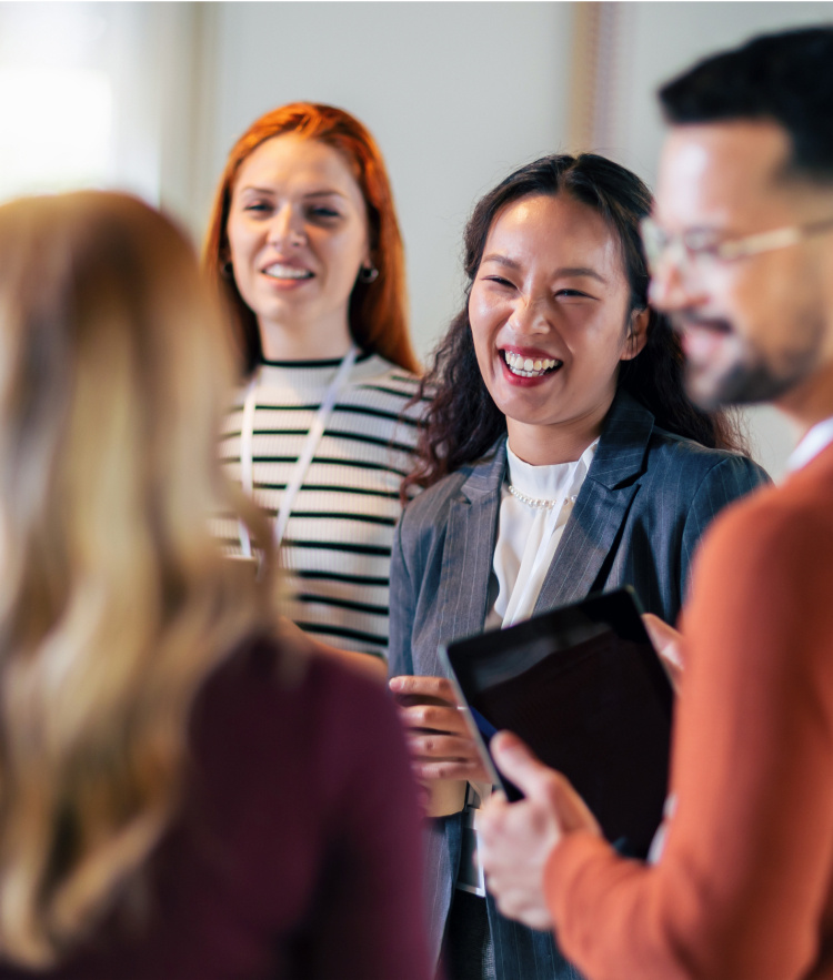 Group of colleagues talking and smiling-mobile