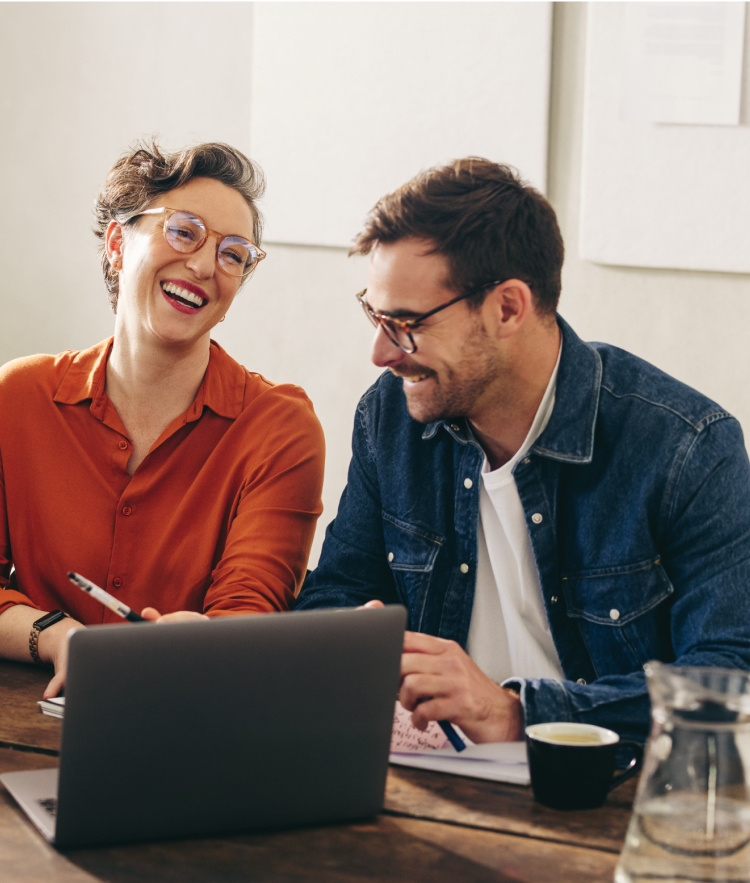 Woman and man and smiling and talking with laptop-mobile