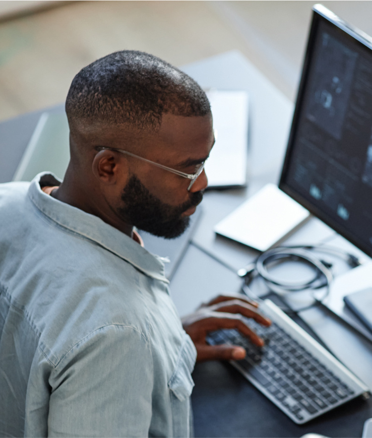 Man in shirt typing on keyboard screen with data-moblie